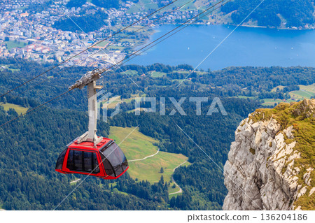 Overhead cable car to the top of Mount Pilatus in Canton Lucerne, Switzerland Overhead cable car to the top of Mount Pilatus in Canton Lucerne, Switzerland 136204186