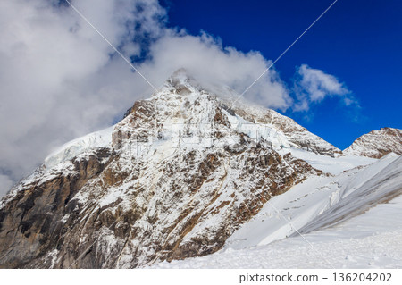 View of Eiger mountain of the Bernese Alps in the Bernese Oberland of Switzerland. Jungfrau region View of Eiger mountain of the Bernese Alps in the Bernese Oberland of Switzerland. Jungfrau region 136204202