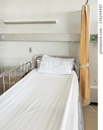 Empty hospital bed in medical ward background. 136204497