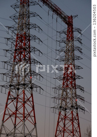 Power line tower at dusk Power line tower at dusk 136204503