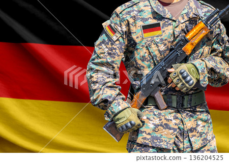Germany flag with soldier holding assault rifle 136204525
