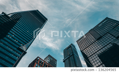 tall skyscrapers buildings looking up perspective, downtown district modern architecture of steel and glass, skyline of big city, low angle look-up view tall skyscrapers buildings looking up perspective, downtown district modern architecture of steel and glass, skyline of big city, low angle look-up view 136204565