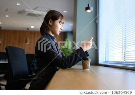 Business woman taking a break Business woman taking a break 136204569