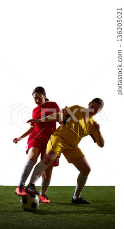Female soccer players in close one on one duel. Female soccer players in close one on one duel. 136205021