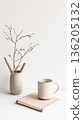 cup of coffee and plant on white background 136205132