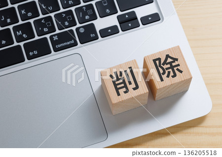 A block with the word "delete" written on it on a computer A block with the word "delete" written on it on a computer 136205518