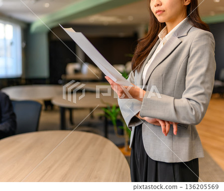 Business woman with documents Business woman with documents 136205569