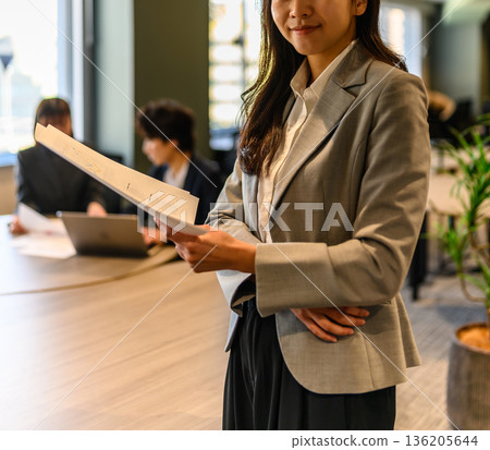 Business woman with documents Business woman with documents 136205644