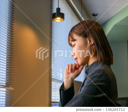 A thoughtful business woman A thoughtful business woman 136205712
