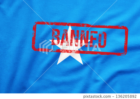 Somalian national flag with red stamp BANNED on it. Fraud Awareness and Scam Prevention Concept. Somalian national flag with red stamp BANNED on it. Fraud Awareness and Scam Prevention Concept. 136205892