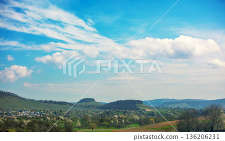 Rural mountain landscape in spring. Farmland during sunset. Countryside in the evening. Abstetterhof village, Ilsfeld, Germany Rural mountain landscape in spring. Farmland during sunset. Countryside in the evening. Abstetterhof village, Ilsfeld, Germany 136206231