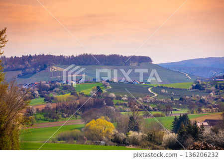 Rural mountain landscape in spring. Farmland during sunset. Countryside in the evening. Abstetterhof village, Ilsfeld, Germany Rural mountain landscape in spring. Farmland during sunset. Countryside in the evening. Abstetterhof village, Ilsfeld, Germany 136206232