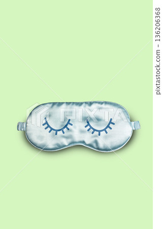 Funny blue sleeping mask with illustrated closed eyes on yellow background. Vertical brochure for World Sleeping Day concept Funny blue sleeping mask with illustrated closed eyes on yellow background. Vertical brochure for World Sleeping Day concept 136206368
