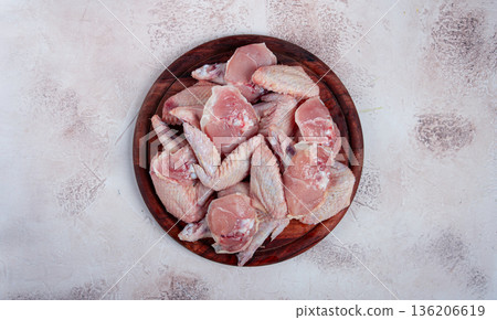 Raw chicken wings, on a wooden board, top view, no people, 136206619