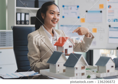 real estate agent home miniature model on documents sale and purchase of apartment notarial deed real estate agent home miniature model on documents sale and purchase of apartment notarial deed 136206872