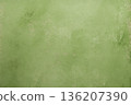 A light green surface is visible with different textures and small spots. It has an irregular pattern, and could work as a solid background 136207390
