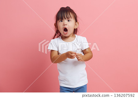 Cute little child looks at the camera in surprise, being struck by unexpected news. An emotional three years old girl expresses surprise, does not believe her eyes. Cute little child looks at the camera in surprise, being struck by unexpected news. An emotional three years old girl expresses surprise, does not believe her eyes. 136207592