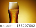 Golden Bubbly Beer in Clean Studio Scene 136207602