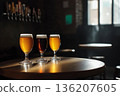 Craft beer glasses on round table in bar 136207605