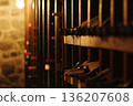 Exploring a rustic wine cellar with wooden racks filled with various bottles of wine 136207608