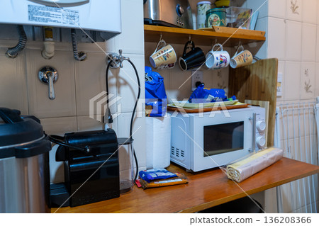 Wooden countertop in a kitchen with appliances Wooden countertop in a kitchen with appliances 136208366