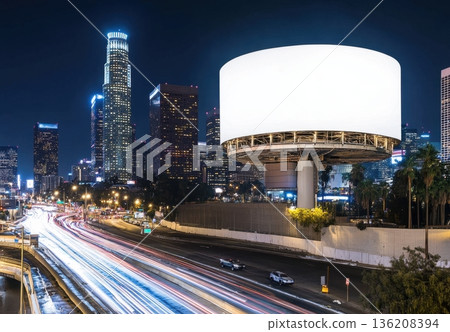 Empty Advertising Billboard in City at Night with Urban Traffic 136208394