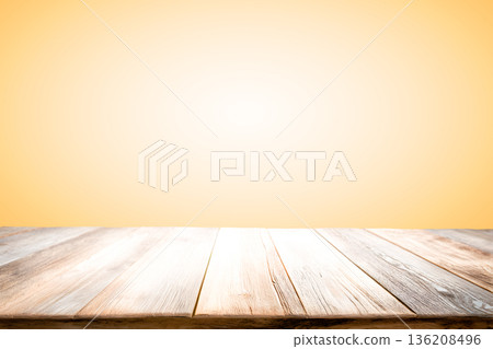 Empty wooden table on orange yellow background for present product. Empty wooden table on orange yellow background for present product. 136208496