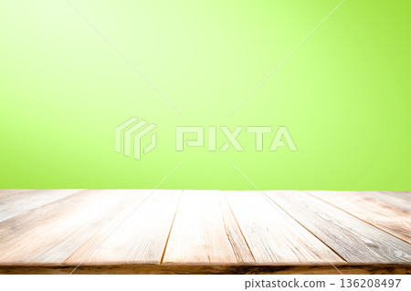 Empty wooden table on green background for present product. Empty wooden table on green background for present product. 136208497