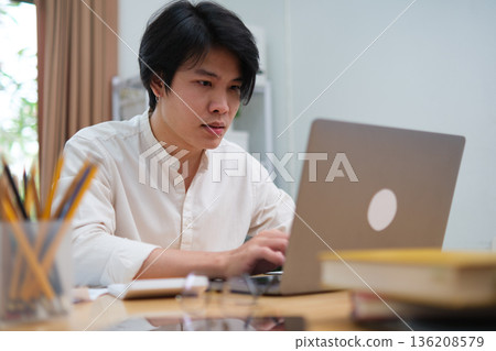 Startup professional working on business project and studying online marketing strategy 136208579