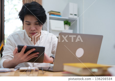University student studying online or startup entrepreneur managing digital business online. 136208584