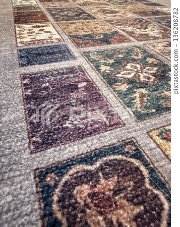 Patchwork carpet pattern with varied floral designs in a textured background Patchwork carpet pattern with varied floral designs in a textured background 136208782