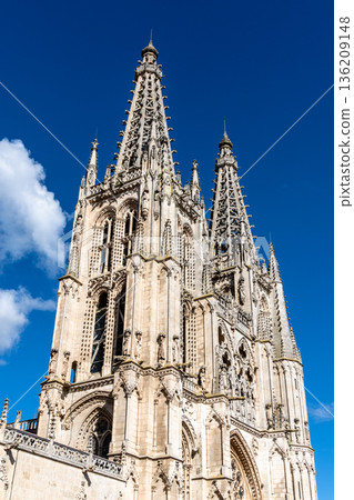 Burgos Cathedral facade against a bright blue sky in Spain 136209148