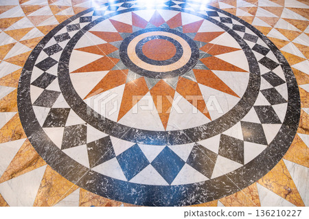 The mosaic pavement features a radial design with geometric shapes. It is located in the Pantheon of the National Museum in Prague. Visitors may admire the craftsmanship of this unique artwork. 136210227