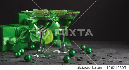 Green Cocktails with Lime, Gifts and Confetti. Festive St. Patricks Day Celebration Still Life Green Cocktails with Lime, Gifts and Confetti. Festive St. Patricks Day Celebration Still Life 136210805