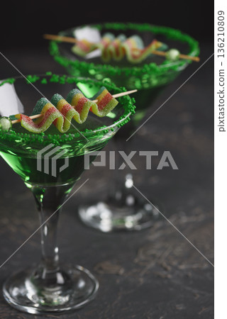 Green Cocktails with Rainbow Candy and Shamrocks. Festive St. Patricks Day Celebration Still Life Green Cocktails with Rainbow Candy and Shamrocks. Festive St. Patricks Day Celebration Still Life 136210809
