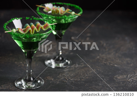 Green Cocktails with Rainbow Candy and Shamrocks. Festive St. Patricks Day Celebration Still Life Green Cocktails with Rainbow Candy and Shamrocks. Festive St. Patricks Day Celebration Still Life 136210810