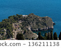 Isola Bella nature reserve near Taormina, Sicily, with rocky islet and blue Ionian Sea 136211138