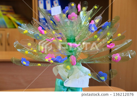 Bouquet crafted from recycled plastic materials by students during a creative lesson, showcasing vibrant colors and innovative design, emphasizing sustainability and environmental awareness Bouquet crafted from recycled plastic materials by students during a creative lesson, showcasing vibrant colors and innovative design, emphasizing sustainability and environmental awareness 136212076