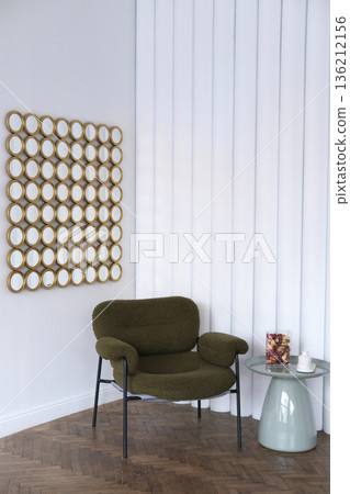 Cozy green armchair positioned beside a modern side table with decorative items, against a backdrop of vertical white panels and a unique mirror arrangement showcasing contemporary design Cozy green armchair positioned beside a modern side table with decorative items, against a backdrop of vertical white panels and a unique mirror arrangement showcasing contemporary design 136212156