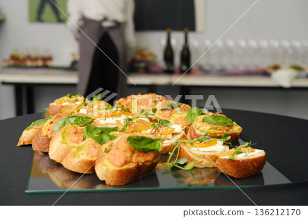 Appetizing platter of gourmet appetizers featuring fresh ingredients, beautifully arranged on a glass serving tray, ideal for catering and banquet event services with copy space Appetizing platter of gourmet appetizers featuring fresh ingredients, beautifully arranged on a glass serving tray, ideal for catering and banquet event services with copy space 136212170