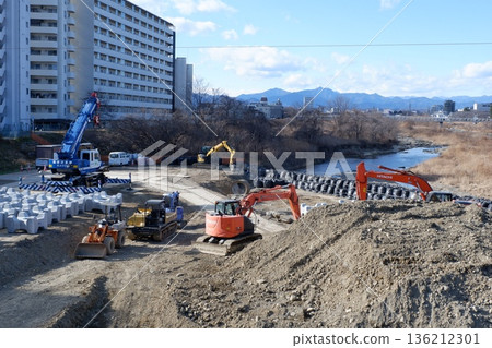 Heavy machinery at a river construction site 136212301