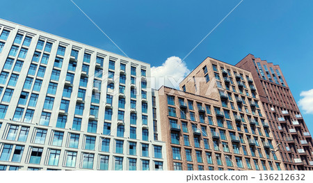 Architecture and real estate, modern residential apartment building with large panoramic windows Architecture and real estate, modern residential apartment building with large panoramic windows 136212632