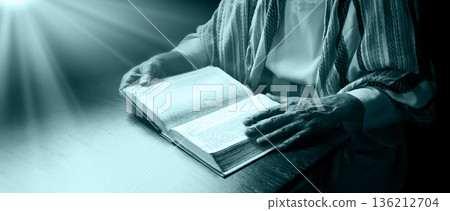 Old man reading a big book Old man reading a big book 136212704
