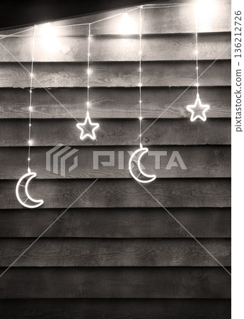 Bright glowing Xmas decoration. Stars and moon Bright glowing Xmas decoration. Stars and moon 136212726