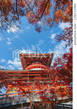 The Great Peace Pagoda of Naritasan Shinshoji Temple stands out against the autumn leaves and blue sky The Great Peace Pagoda of Naritasan Shinshoji Temple stands out against the autumn leaves and blue sky 136213404