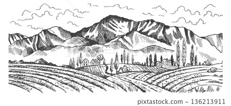 A mountain range with a small town in the valley 136213911