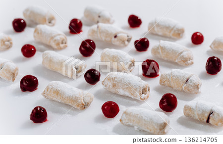 Powdered sugar cherry rugelach cookies pattern on white background, top view Powdered sugar cherry rugelach cookies pattern on white background, top view 136214705