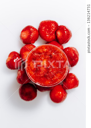 Overhead strawberry panna cotta cup with fresh berries on white background 136214731