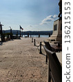 Outdoor Cafe Tables with Statue and Lake View 136215153
