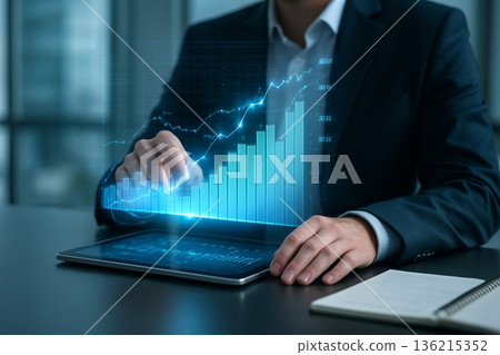 Analyst Pointing To Chart On Tablet In Office 021125 136215352